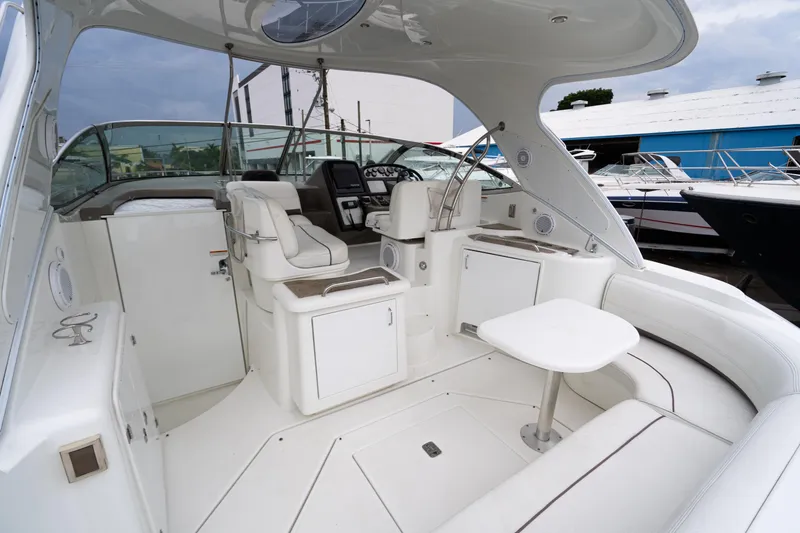 Slide: The Image of 2008 Cruisers 420 Express yacht interior with white seating and helm station. - 6