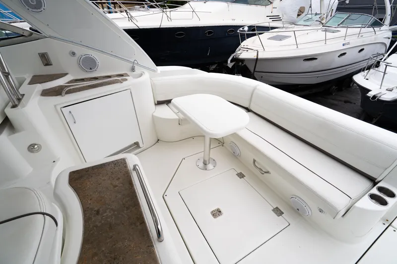 Slide: The Image of 2008 Cruisers 420 Express yacht interior with white seating and table. - 7