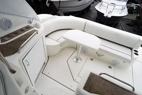 Slide: The Image of 2008 Cruisers 420 Express yacht interior with white seating and table. - 8