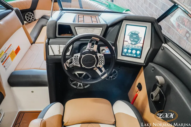 Slide: The Image of 2018 Tigé Z3 boat interior with modern dashboard and touchscreen controls. - 10