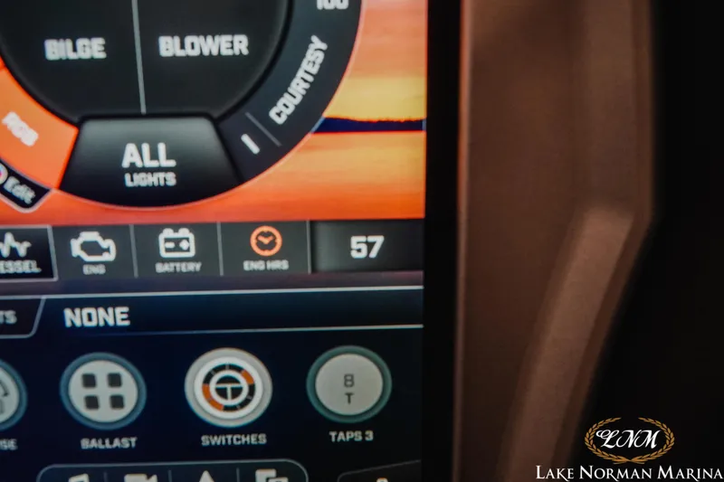 Slide: The Image of Close-up of 2018 Tigé Z3 boat dashboard display showing engine hours and controls. - 15