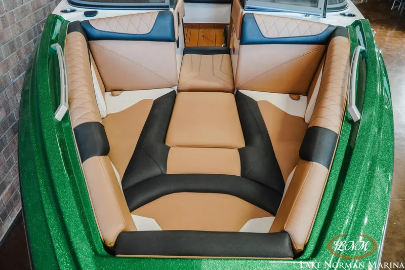 Slide: The Image of 2018 Tigé Z3 boat interior with green exterior and tan seating. - 4