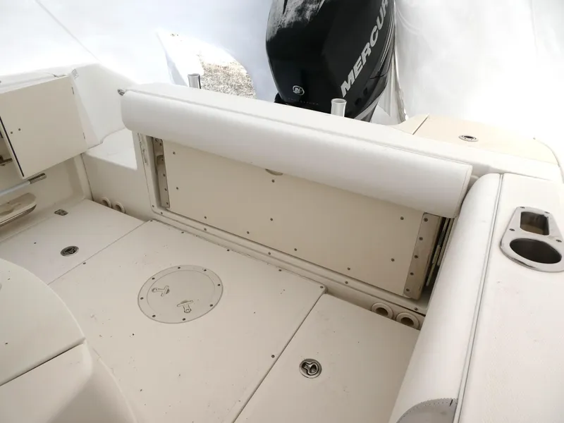Slide: The Image of 2014 Boston Whaler 220 Outrage boat interior with seating and Mercury engine. - 6