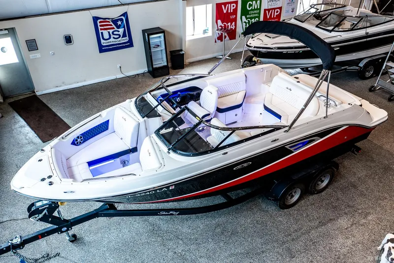 The Image of 2020 Sea Ray 230SLX boat in showroom, featuring sleek design and modern amenities. - 0