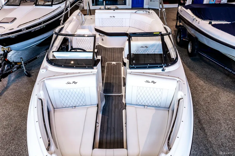 Slide: The Image of 2020 Sea Ray 230SLX boat interior with white seating and sleek design. - 10