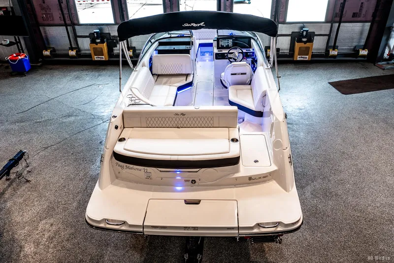 Slide: The Image of 2020 Sea Ray 230SLX boat in a showroom, showcasing sleek design and spacious interior. - 12