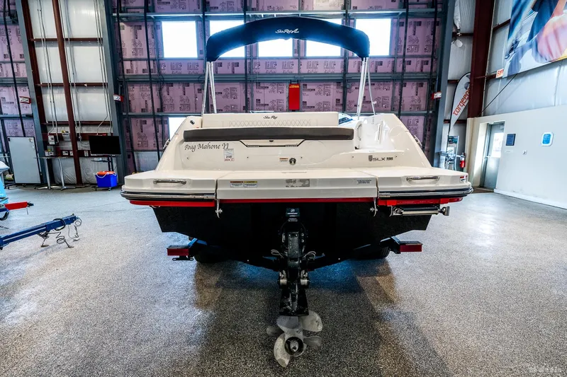 Slide: The Image of 2020 Sea Ray 230SLX boat in indoor storage, rear view. - 14