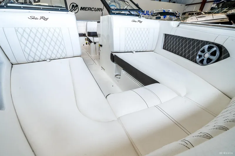 Slide: The Image of Interior of 2020 Sea Ray 230SLX boat with white leather seating and speaker system. - 23