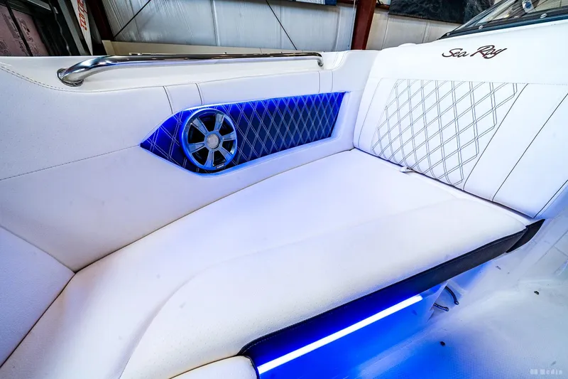 Slide: The Image of Luxurious interior of 2020 Sea Ray 230SLX boat with blue LED lighting and stylish seating. - 27