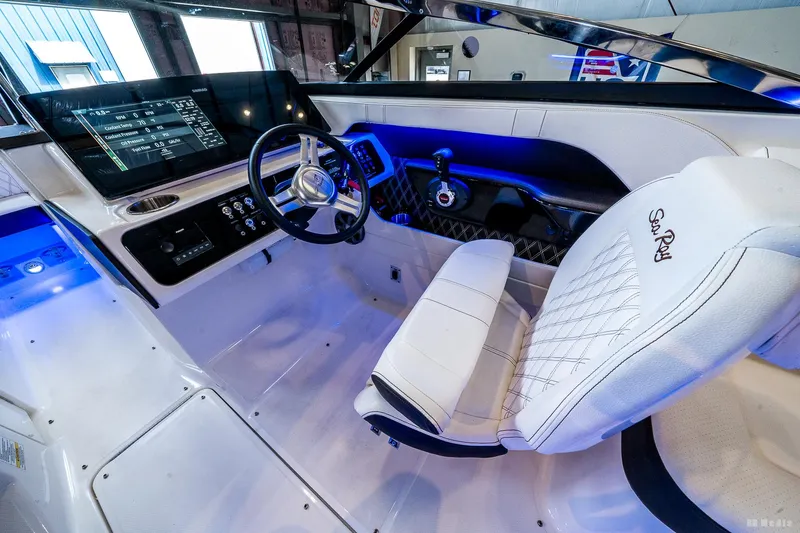 Slide: The Image of Interior of 2020 Sea Ray 230SLX boat with modern dashboard and steering wheel. - 29