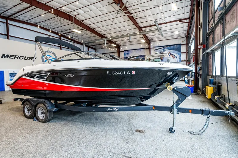 Slide: The Image of 2020 Sea Ray 230SLX boat on trailer in indoor storage facility. - 3