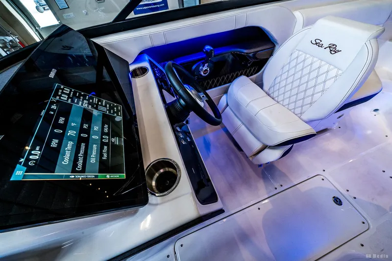 Slide: The Image of 2020 Sea Ray 230SLX boat interior with modern dashboard and luxurious seating. - 30