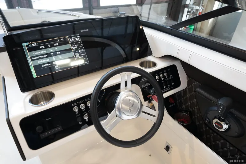 Slide: The Image of 2020 Sea Ray 230SLX boat dashboard with steering wheel and digital display. - 32