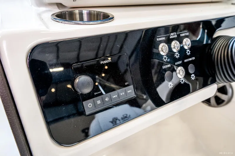 Slide: The Image of Control panel of 2020 Sea Ray 230SLX boat with audio system and buttons. - 35