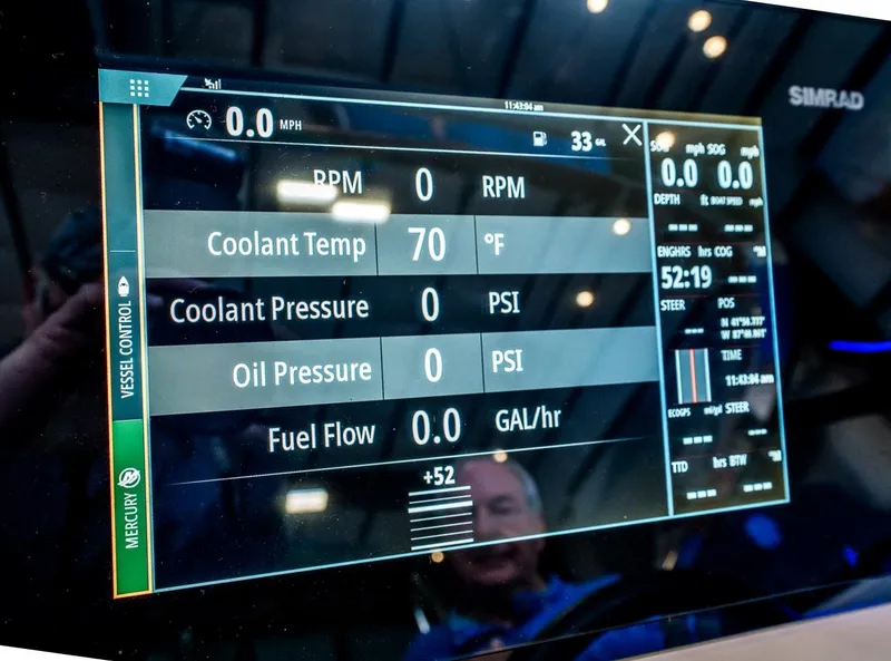 Slide: The Image of Dashboard display of a 2020 Sea Ray 230SLX showing engine metrics and controls. - 38
