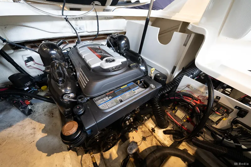Slide: The Image of Engine compartment of a 2020 Sea Ray 230SLX boat, showcasing detailed mechanical components. - 39