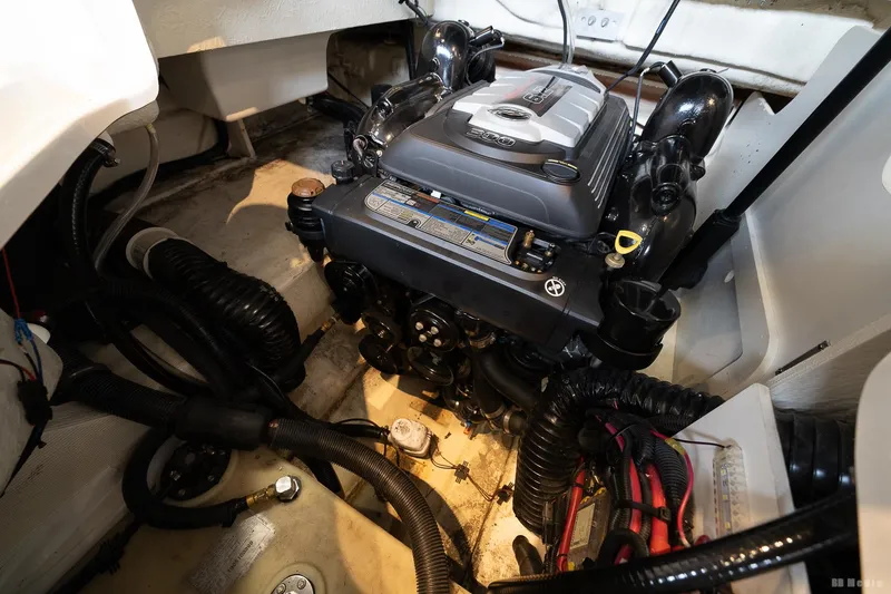 Slide: The Image of Engine compartment of a 2020 Sea Ray 230SLX boat, showcasing detailed mechanical components. - 40