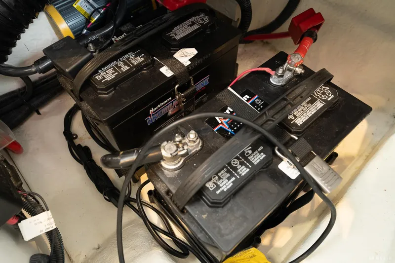 Slide: The Image of Batteries in a 2020 Sea Ray 230SLX boat, showing wiring and connections. - 42