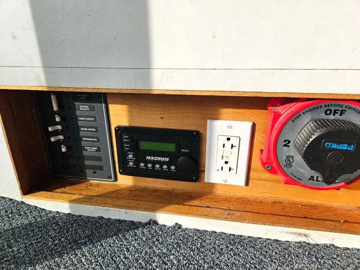 Slide: The Image of Electrical panel and controls on a 1978 Mainship 34 Sedan boat. - 16