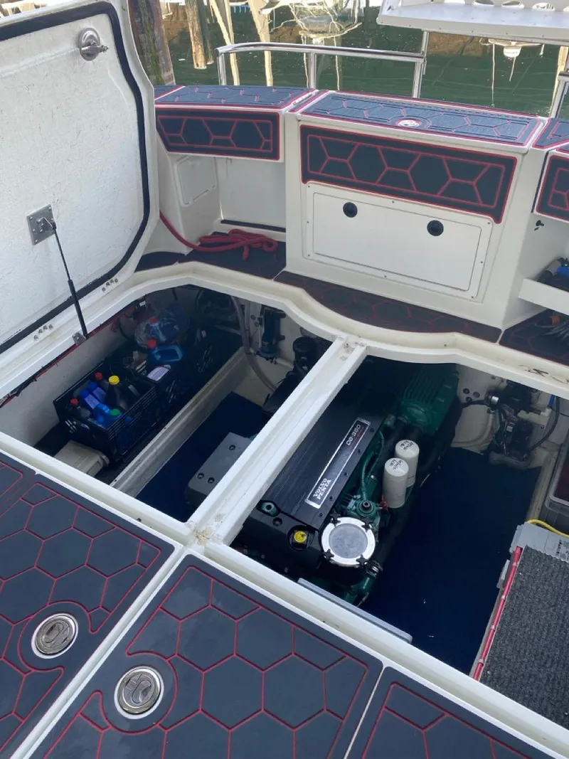 Slide: The Image of Engine compartment of a 2005 Ocean Sport Roamer 30 boat, showcasing detailed interior components. - 22