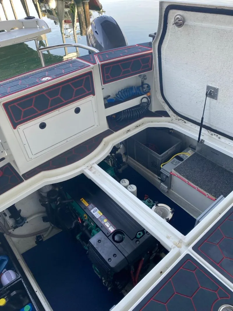 Slide: The Image of Engine compartment of a 2005 Ocean Sport Roamer 30 boat, showcasing detailed interior components. - 23