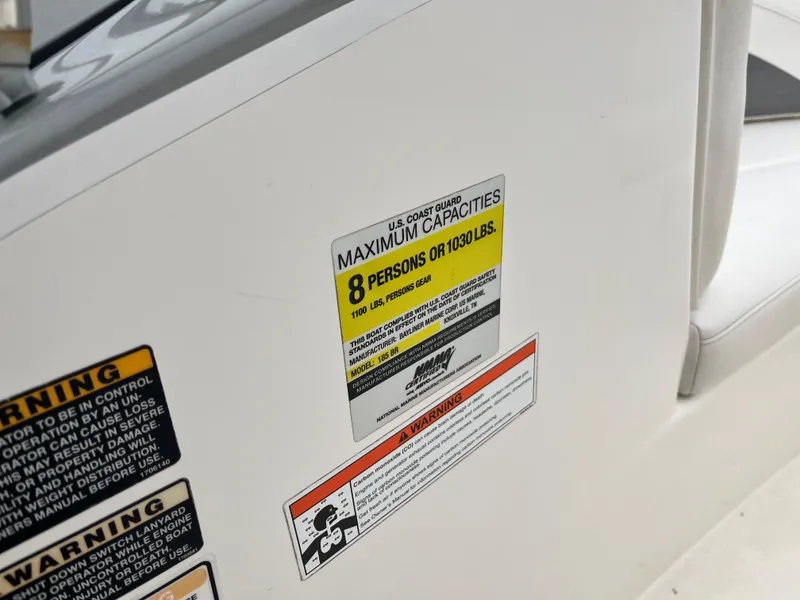 Slide: The Image of 2009 Bayliner 185 capacity label, maximum 8 persons or 1030 lbs. - 19