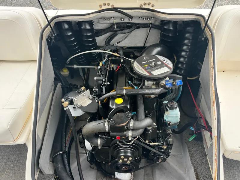 Slide: The Image of Engine compartment of a 2009 Bayliner 185 boat, showcasing detailed mechanical components. - 20
