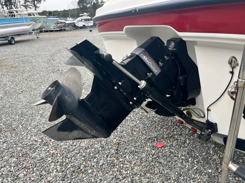 Slide: The Image of 2009 Bayliner 185 boat with MerCruiser outdrive on gravel lot. - 6