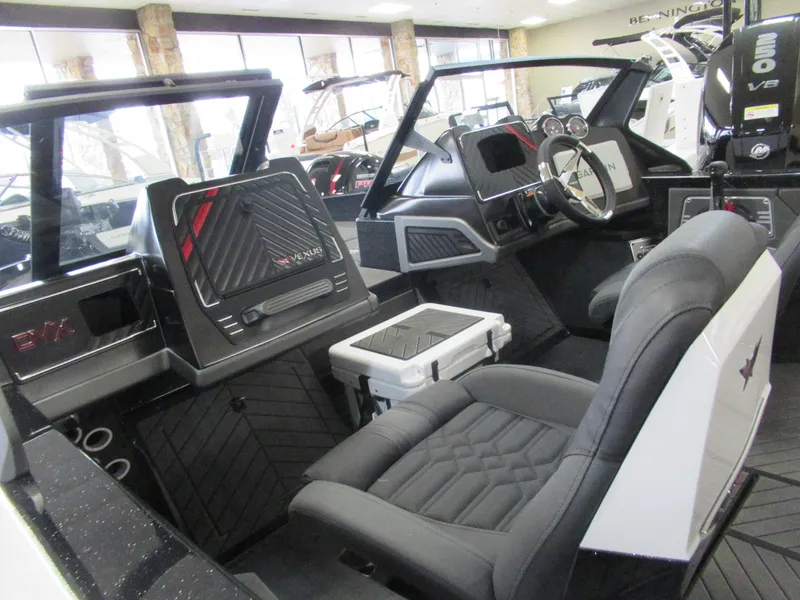 Slide: The Image of 2025 Vexus DVX20S boat interior with modern dashboard and comfortable seating. - 2