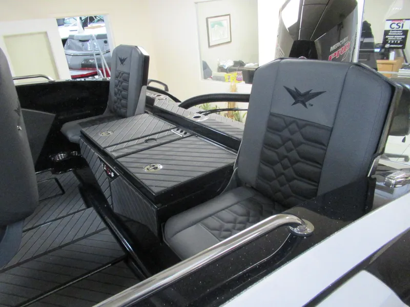 Slide: The Image of 2025 Vexus DVX20S boat interior with sleek black seating and modern design. - 5