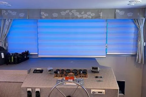 Slide: The Image of Control panel of a 1977 Gibson Standard boat with blue-lit windows. - 37