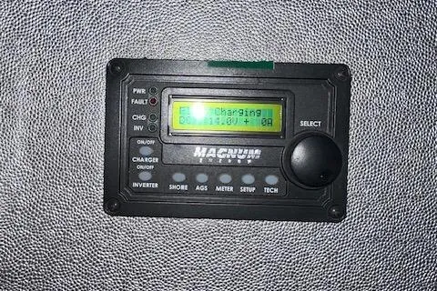 Slide: The Image of Digital control panel displaying charging status on a textured surface. - 39