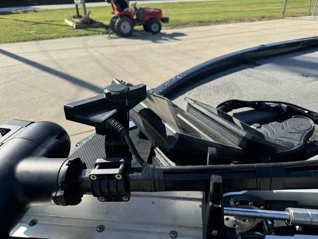 Slide: The Image of Close-up of 2021 Phoenix 921 ELITE boat equipment with a tractor in the background. - 12