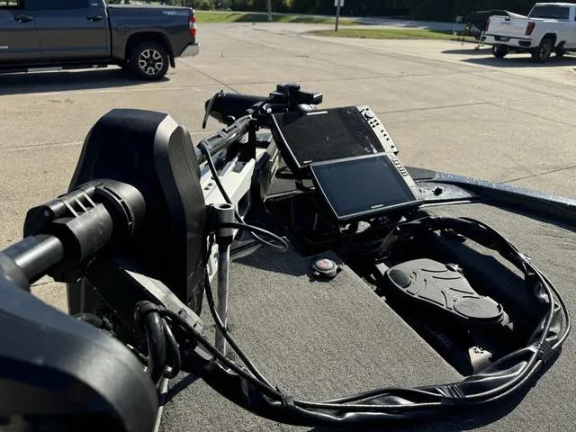 Slide: The Image of 2021 Phoenix 921 ELITE boat dashboard with advanced navigation equipment in a parking lot. - 14