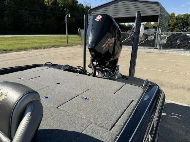 Slide: The Image of 2021 Phoenix 921 ELITE boat with Mercury engine, parked outdoors. - 16