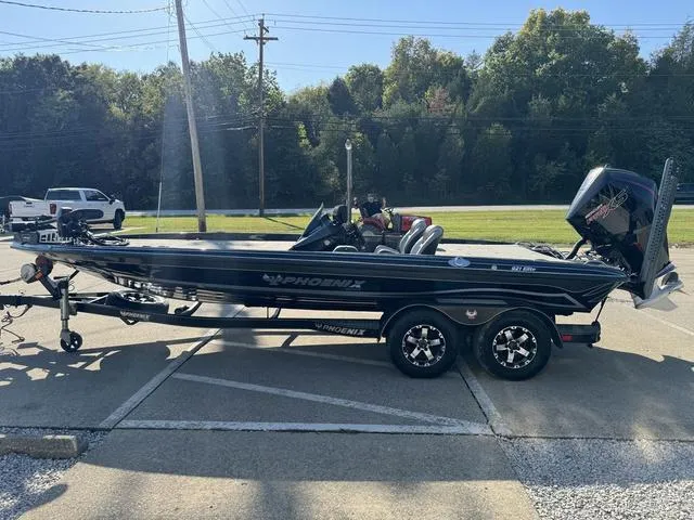 Slide: The Image of 2021 Phoenix 921 ELITE boat on trailer, parked outdoors, side view. - 18