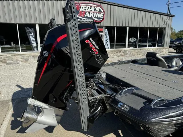 Slide: The Image of 2021 Phoenix 921 ELITE boat with powerful outboard motor at Weda's Marine dealership. - 3
