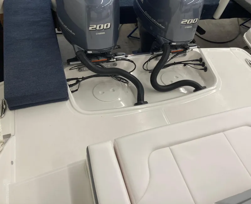 Slide: The Image of 2020 Chaparral 280 OSX boat with dual Yamaha 200 engines, rear seating area. - 11