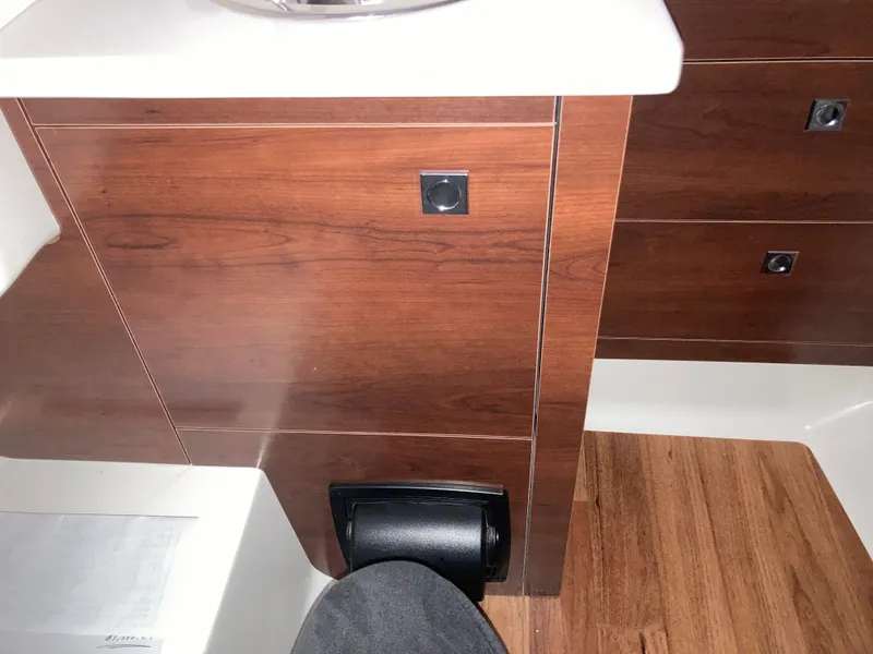 Slide: The Image of Interior of 2020 Chaparral 280 OSX with wood paneling and modern design. - 17