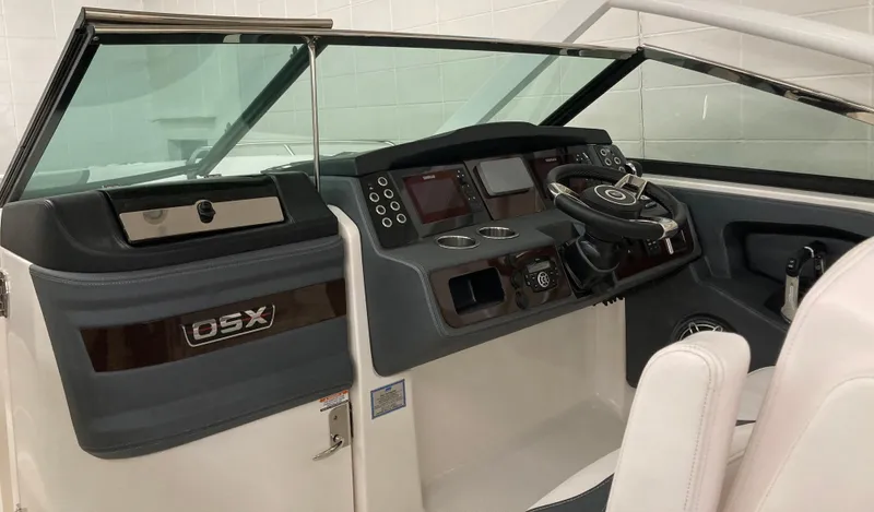 Slide: The Image of 2020 Chaparral 280 OSX boat dashboard with steering wheel and control panel. - 5