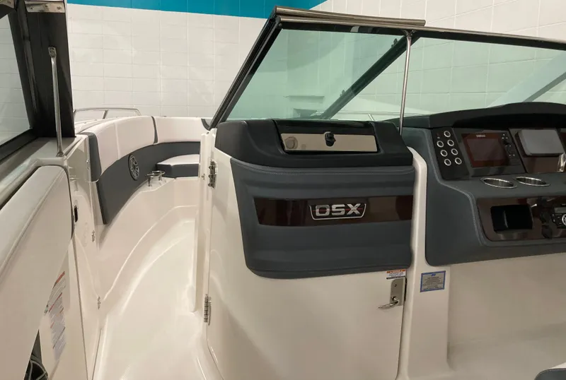 Slide: The Image of 2020 Chaparral 280 OSX boat interior with modern dashboard and seating. - 7