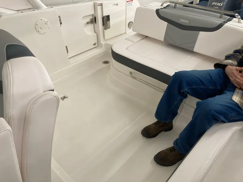 Slide: The Image of Interior of a 2020 Chaparral 280 OSX boat with seating and storage compartments. - 9