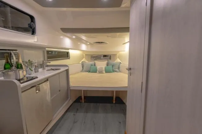 Slide: The Image of Luxurious interior of 2025 Hanover 387 Grey & Black Edition Outboard boat cabin. - 11