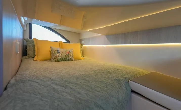 Slide: The Image of Cozy cabin interior of 2025 Hanover 387 Grey & Black Edition Outboard with elegant bedding. - 13