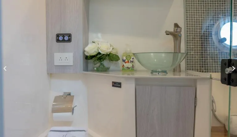 Slide: The Image of Luxurious bathroom in 2025 Hanover 387 Grey & Black Edition Outboard boat. - 14