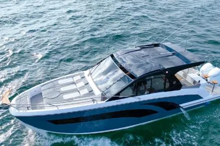 Slide: The Image of 2025 Hanover 387 Grey & Black Edition Outboard cruising on open water. - 3