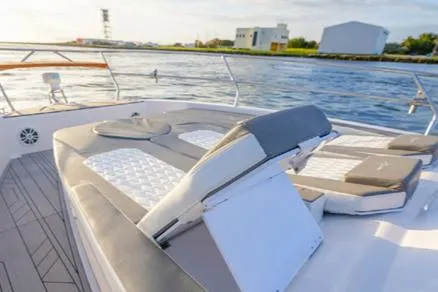 Slide: The Image of 2025 Hanover 387 Grey & Black Edition Outboard boat with luxurious seating on deck. - 6