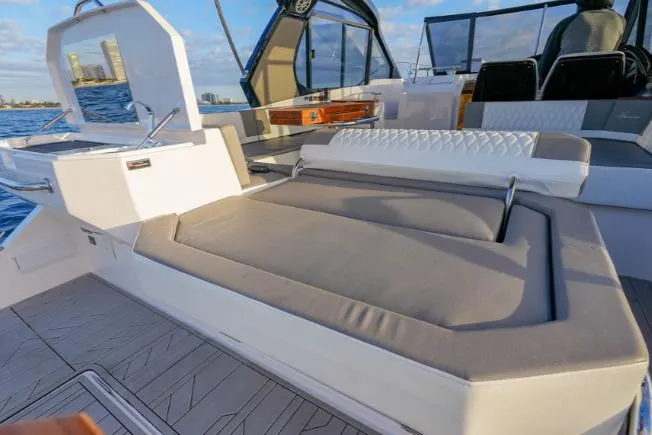 Slide: The Image of 2025 Hanover 387 Grey & Black Edition Outboard, luxurious deck seating, ocean view. - 8