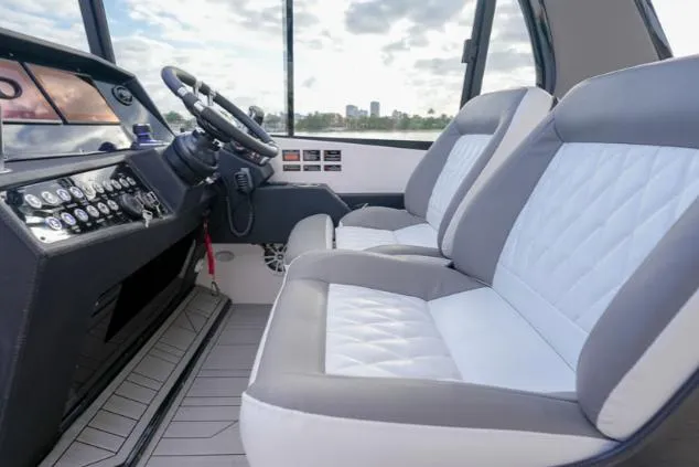 Slide: The Image of Interior of 2025 Hanover 387 Grey & Black Edition Outboard, featuring modern seating and controls. - 9