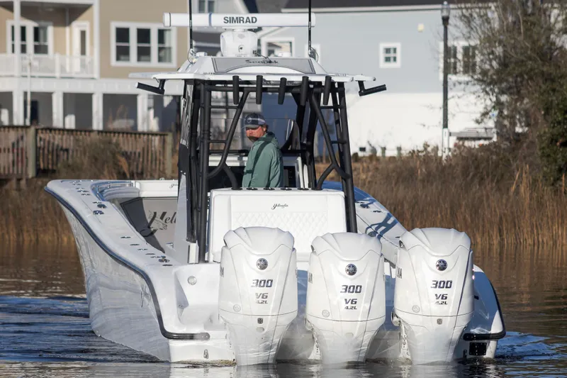 Slide: The Image of 2020 Yellowfin 36 Offshore boat with triple 300 V6 engines on calm water. - 6